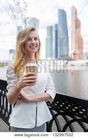 Young beautiful girl with coffee to go