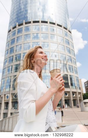 Beautiful Woman with Coffee to Go in the City.