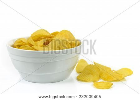 Crispy Potato Chips In A Bowl Isolated On A White Background.