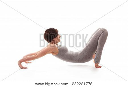Young Beautiful Woman Yoga Posing On Isalated White Studio Background