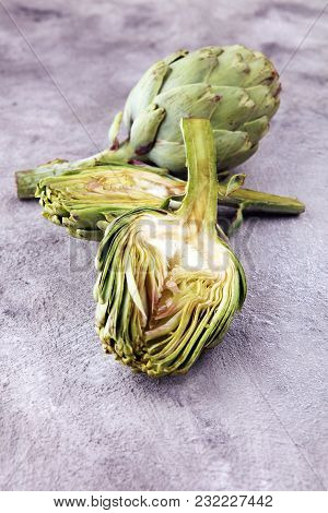 Artichokes On Grey Background. Fresh Organic Artichoke Flower.