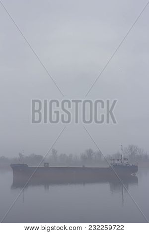 Ship In The Fog In The Morning On The River.