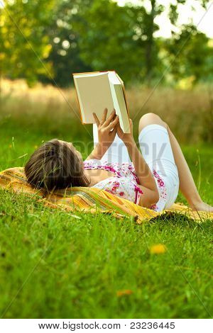 Beatiful Woman Relaxing In The Park