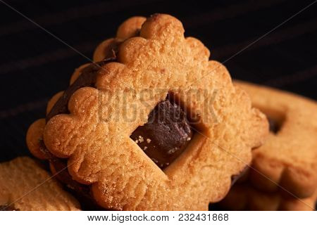 Chocolate Sand Chip Cookies Stacked Up On A Plate, Ready To Be Served.