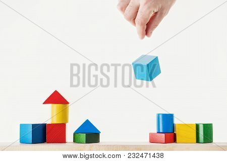 Male Hand Juggling Wooden Cube. Concept Of Creative, Logical Thinking.