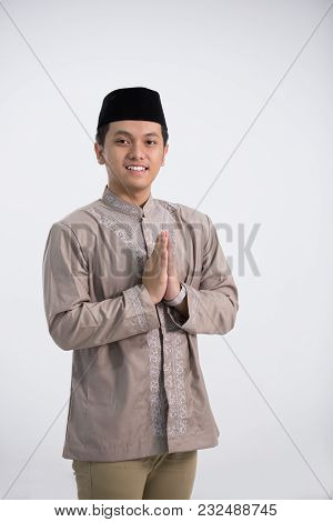 A Muslim Man Stand And Pose In Front Of The Camera