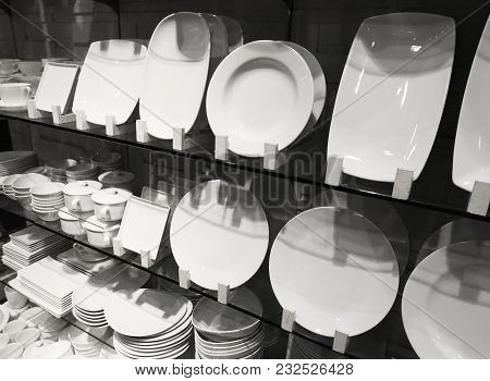 Stack Of Dishes On The Shelf In The Shop