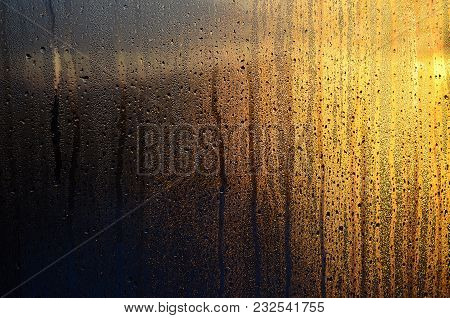The Texture Of Misted Glass With A Lot Of Drops And Drips Of Condensation Against The Sunlight At Da