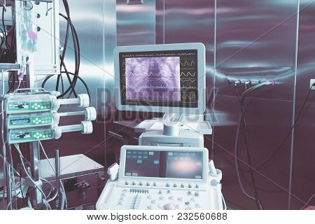 Ecg And Chest X-ray Image On The Display Of Medical Computer In The Room With Steel Shiny Walls.