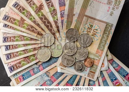 Cuban Convertible Pesos (cuc) On The Table. Cuban Convertible Banknotes And Coins
