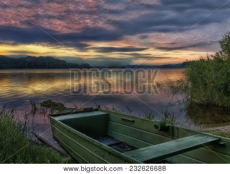 Rowboat On Beautiful Lake With Dramatic Sunset.the Morning Of The Loch.landscape With Boat.a Fishing