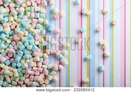Marshmallows On A Striped Background . Background Or Texture Of Colorful Mini Marshmallows.top View,