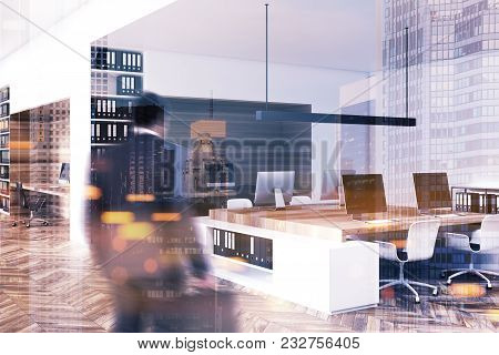 Modern Office With A Wooden Floor, Bookcases And Rows Of Computer Tables. Original Workspece Devitio