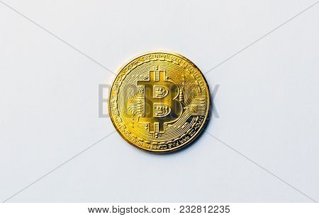 Golden Bitcoin On White Background. Concept Mining. Copyspace