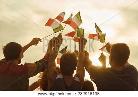 Glowing Sun On Patriotic Italian People. Patriotic Family, Rear View. Evening Sky.