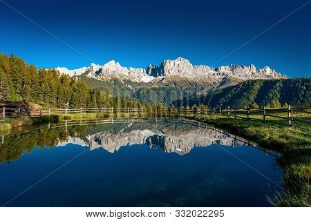 Reflections Of The Rosengarten Mountains In The Water Of The Wuh