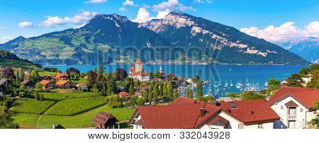 Aerial Panoramic View Of Spiez Church And Castle On The Shore Of Lake Thun In The Swiss Canton Of Be