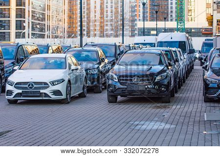 Luxury Cars Mercedes-benz C And E Class Parkingin A Row Of Car Store. View Of The Sign Symbol, Front