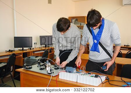 Chapaevsk, Samara Region, Russia - April 16, 2019: Students Connect Wires Control Panel With A Small