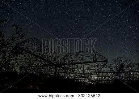 Part Of Antennas Array Of Radio Astronomy Telescope On Background Of Night Sky With Stars And Conste