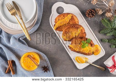 Traditional Christmas Rabanadas With Egg Yolk Cream And Cinnamon. Spanish Torrijas Close Up On The C
