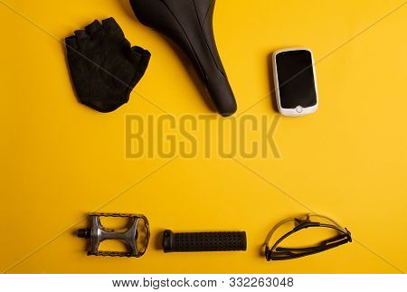 Bicycle, Cycling Accessories On The Yellow Background. View From Above