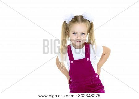 Adorable Little Girl With A Soccer Ball. The Concept Of Childrens Sports, Summer Outdoor Recreation.