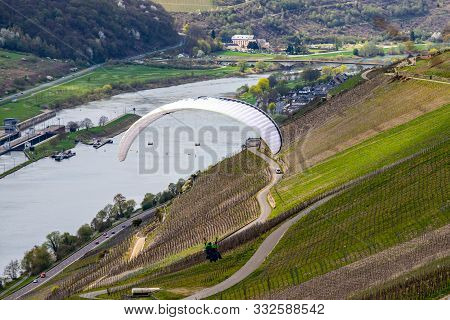 Flying Paraglider Over The Valley Of River Moselle And Over Vineyards