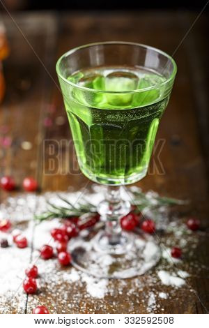 Absinthe Is Poured Into A Beautiful Old Glass, Stands On The Bar Counter. Sugar Is Beautifully Sprin