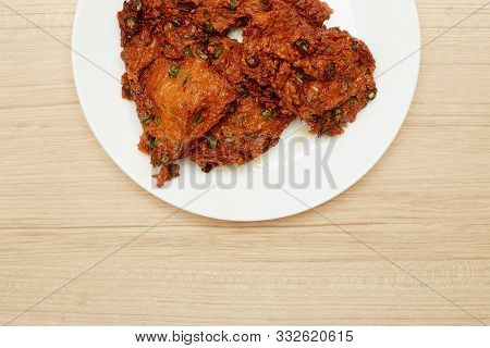 Deep Fried Fish Paste Balls Served On White Plate Set On Wooden