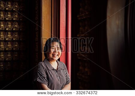 Woman At Wat Boromracha Kanchanapisek Anusorn