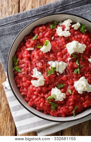 Italian Orzotto With Beets, Goat Cheese And Herbs Close-up On A Plate. Vertical Top View