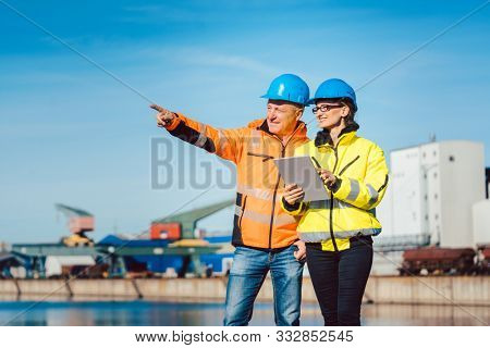 Workers in a commercial river port having a work meeting