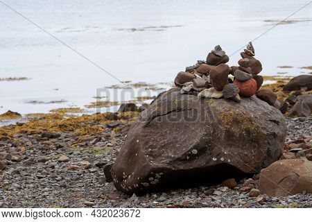 A Pile Of Stones On A Boulder On A Rocky Beach In Gransd Manan