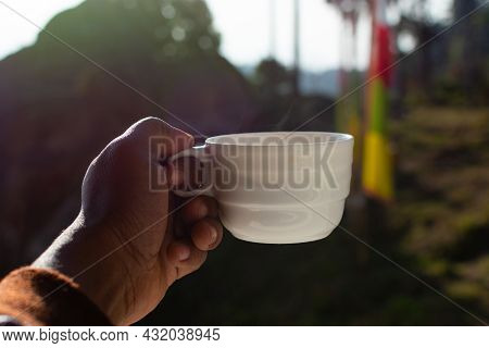 Indian Man's Hand Holding Clay Cup Of Hot Darjeeling Tea In Hotel Room At The Hill Station.