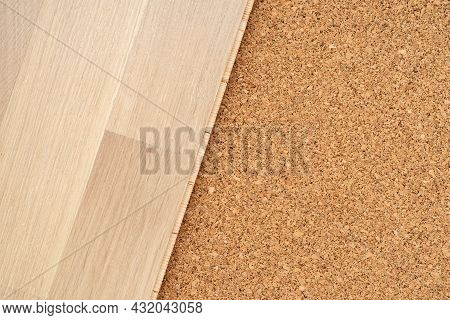 Finishing Materials For Flooring. Laying Parquet Boards On Natural Cork For Underlayment.