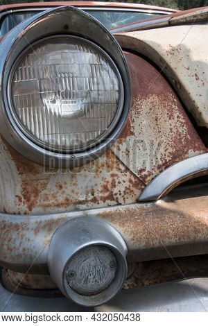 Partial View Of The Front Of An Old Rusted Car