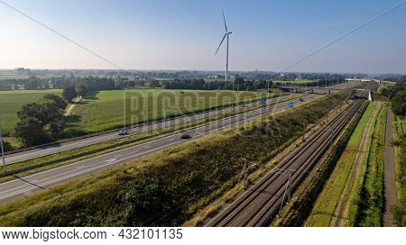 Motorway With Few Cars And Railroad Next To It, Near The Exit Of Brecht In Belgium, Europe. High Qua
