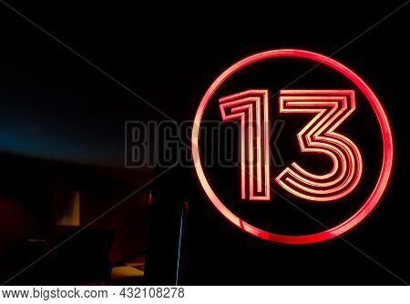 Lucky Number 13 On The Red Light Sign Top Of The Cinema Door