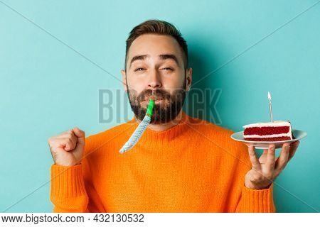 Close-up Of Funny Adult Man Celebrating His Birthday, Holding Bday Cake With Candle, Blowing Party W