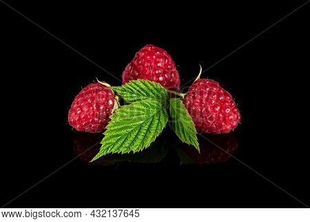 Raspberry Isolated. Raspberries With Leaf Isolate. Raspberry With Leaf Isolated On Black Background