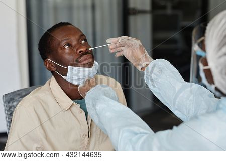 African-american Man Visiting Doctor For Nasal Swab To Get Laboratory Coronavirus Test