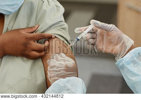 Close-up Image Of Female Patient Getting Injection Of Vaccine Against Covid-19 In Clinic