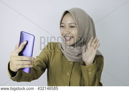 Smile Government Worker Women When Video Call Using A Smartphone. Pns Wearing Khaki Uniform.