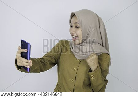 Smile Government Worker Women When Video Call Using A Smartphone. Pns Wearing Khaki Uniform.