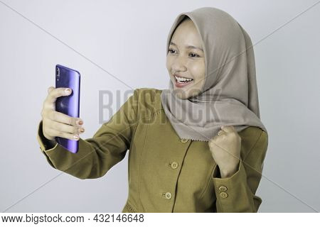 Smile Government Worker Women When Video Call Using A Smartphone. Pns Wearing Khaki Uniform.