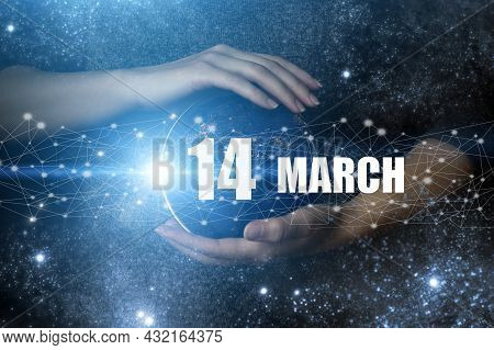 March 14th. Day 14 Of Month, Calendar Date. Human Holding In Hands Earth Globe Planet With Calendar 
