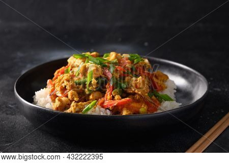Traditional Thai Breakfast Gai Pad Pongali With Chicken, Eggs, Yellow Thai Curry Paste On Rice.