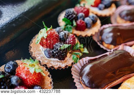 Assorted Cakes For The Holiday. Candy Bar. Sweet Birthday Treats.