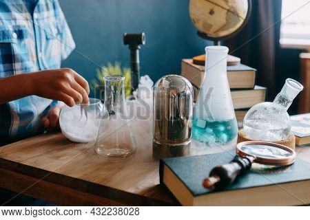 Childrens Hands Are Doing A Chemical Experiment.